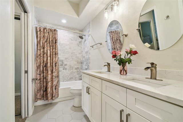 full bathroom featuring shower / bath combination with curtain, vanity, and toilet