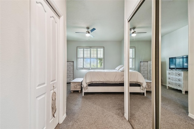 bedroom with ceiling fan and carpet flooring