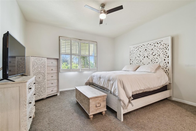 bedroom featuring dark colored carpet and ceiling fan