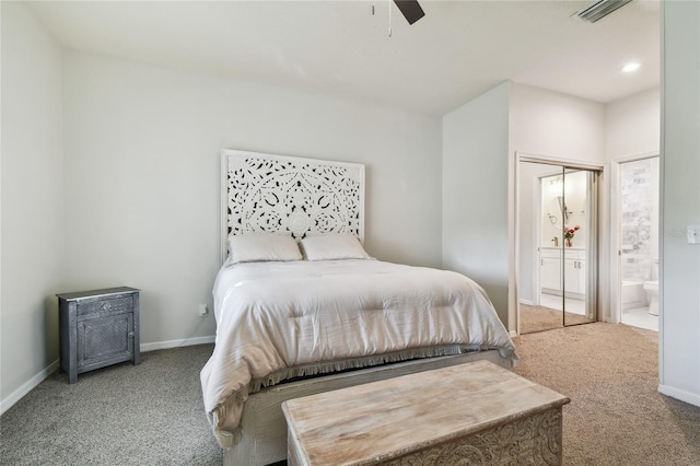 carpeted bedroom with ceiling fan and connected bathroom