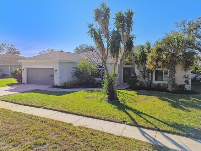 view of front of home featuring a garage and a front lawn