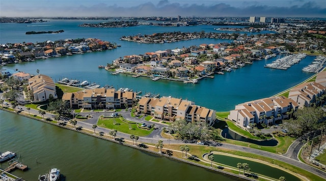 drone / aerial view featuring a water view and a residential view