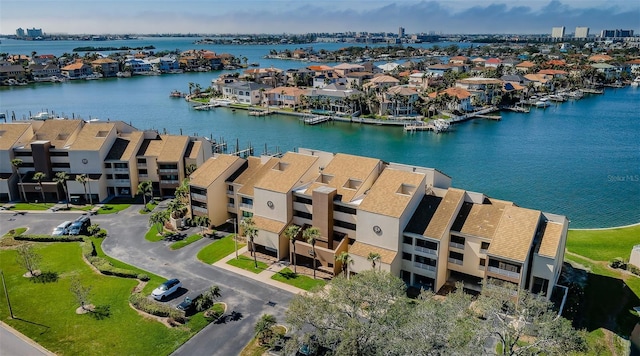 drone / aerial view featuring a water view and a residential view