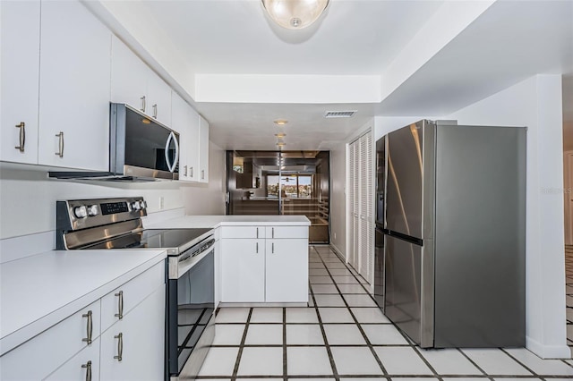 kitchen featuring white cabinetry, visible vents, appliances with stainless steel finishes, and light countertops