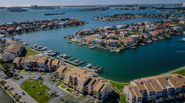 drone / aerial view featuring a residential view and a water view