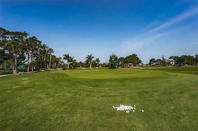 surrounding community featuring view of golf course