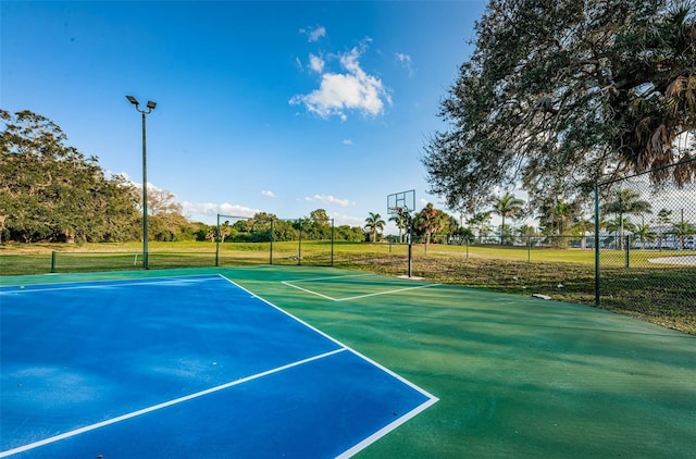 view of sport court featuring community basketball court and fence