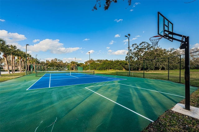 view of sport court featuring community basketball court and fence