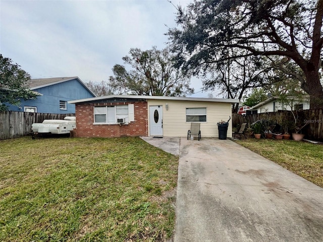 view of front of home with cooling unit and a front yard