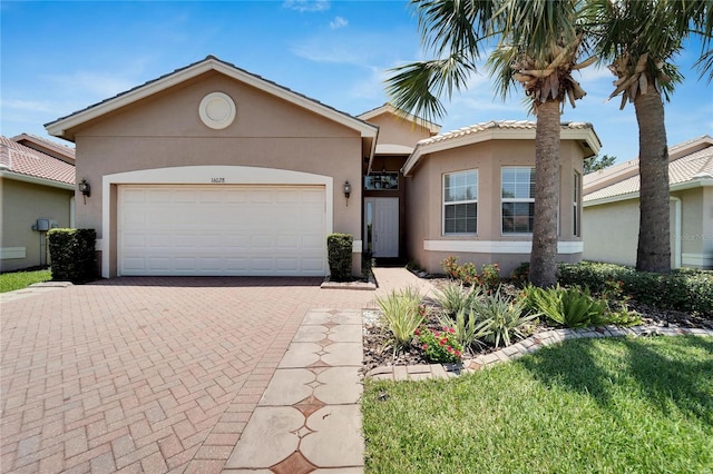 single story home with a garage