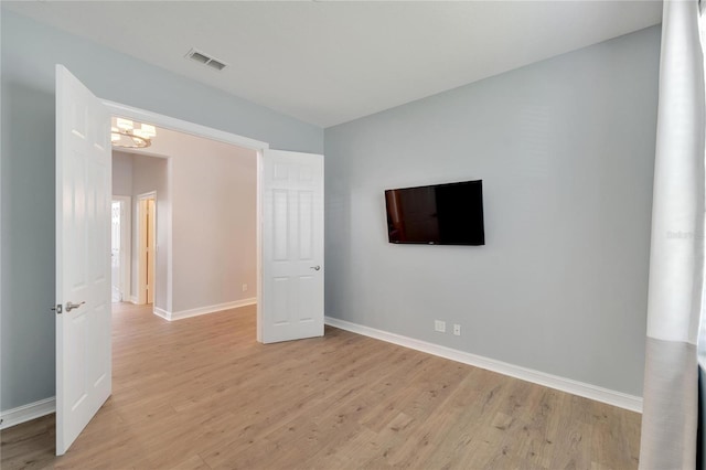 unfurnished bedroom with light hardwood / wood-style flooring