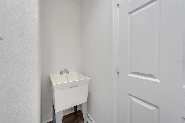 interior space with hardwood / wood-style flooring and sink