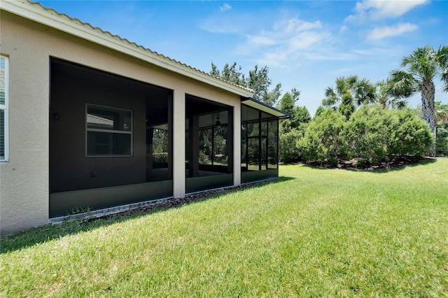 view of yard featuring a sunroom