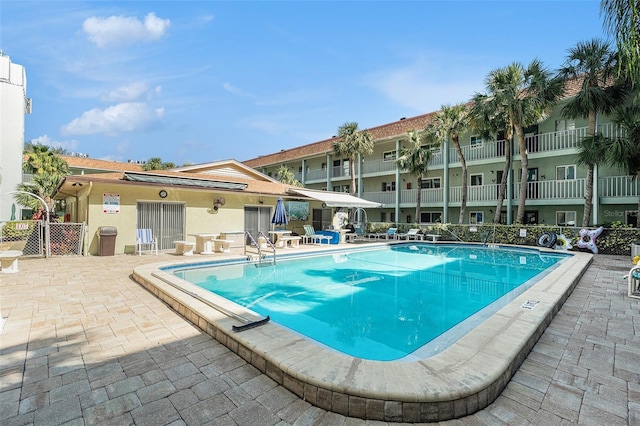 view of pool featuring a patio