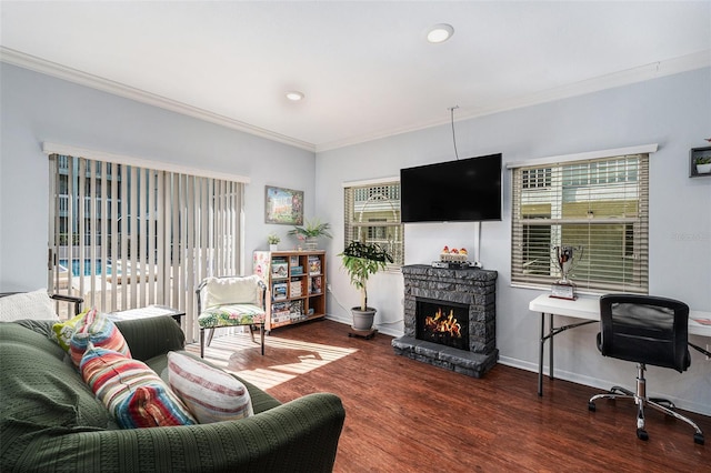 living room with ornamental molding, dark wood-type flooring, and a fireplace