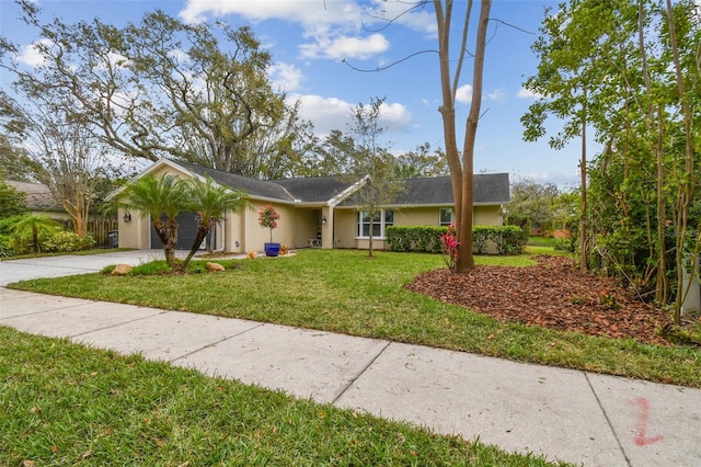 ranch-style house featuring a front lawn, concrete driveway, an attached garage, and stucco siding