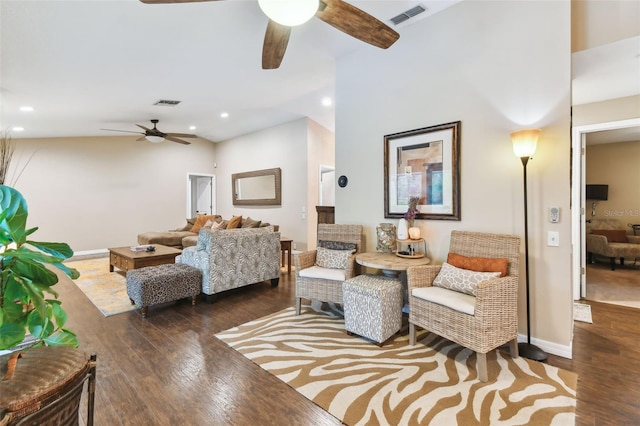 living room featuring dark wood-style floors, recessed lighting, visible vents, and baseboards