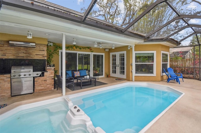 view of pool with ceiling fan, a grill, an AC wall unit, a patio area, and outdoor lounge area