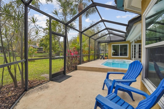 sunroom / solarium featuring lofted ceiling and a hot tub