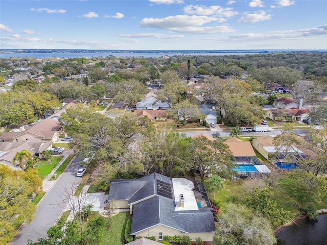 drone / aerial view with a water view and a residential view