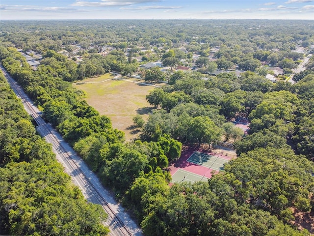 birds eye view of property with a view of trees