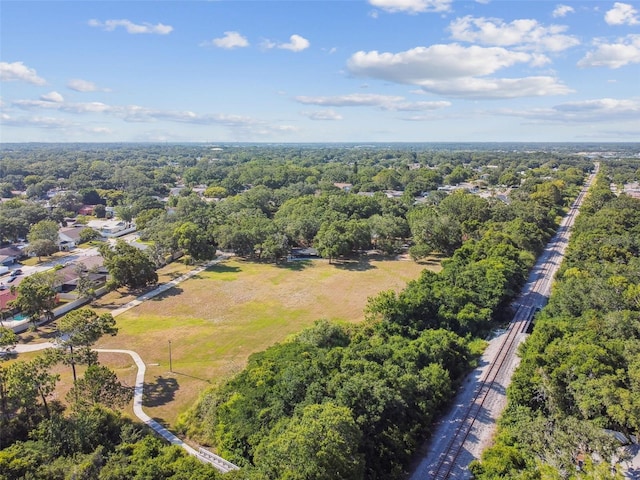 drone / aerial view featuring a forest view