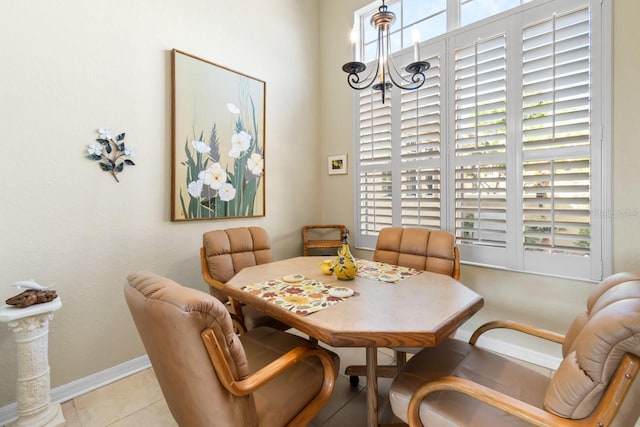 dining space featuring light tile patterned flooring