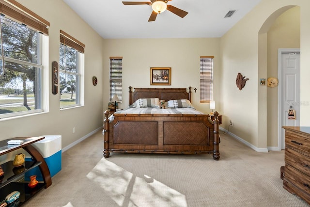 bedroom with light colored carpet and ceiling fan