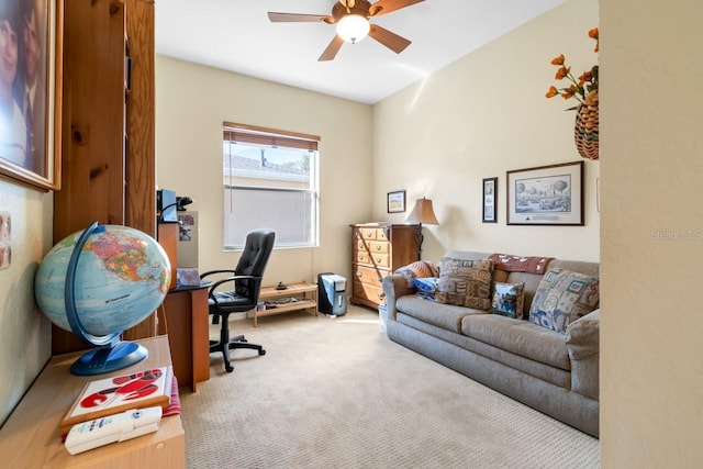 carpeted office featuring ceiling fan