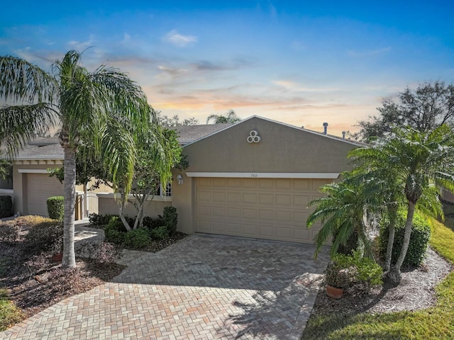 single story home with a garage