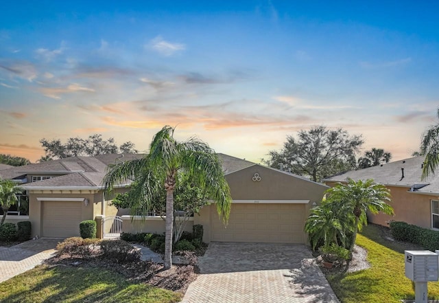 single story home featuring a garage