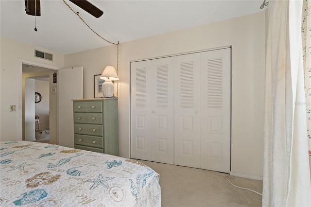 bedroom with light carpet, a closet, and ceiling fan