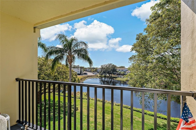 balcony featuring a water view