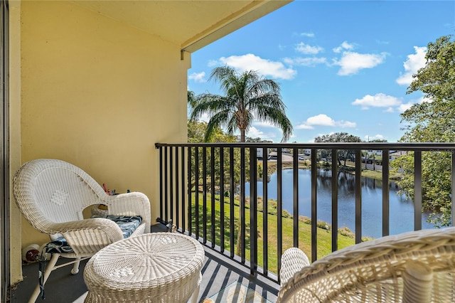 balcony featuring a water view