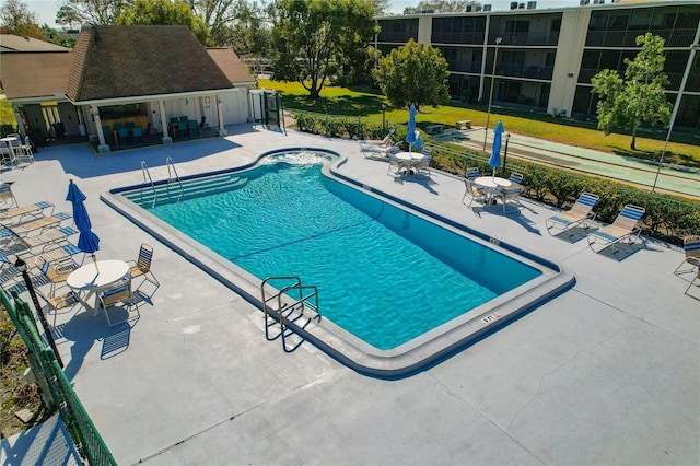 view of swimming pool with a patio area