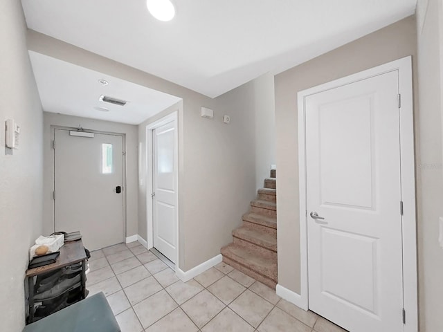 entrance foyer featuring light tile patterned flooring