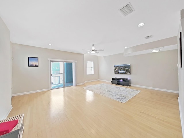 unfurnished living room featuring ceiling fan and light hardwood / wood-style flooring