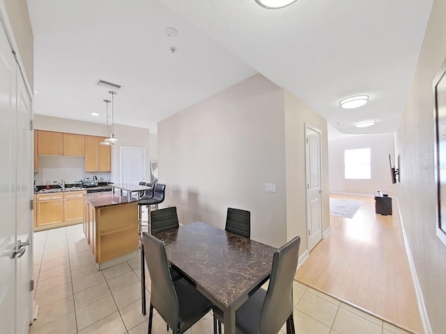 dining area with light tile patterned floors