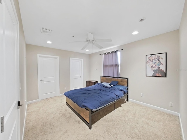 bedroom featuring light colored carpet and ceiling fan