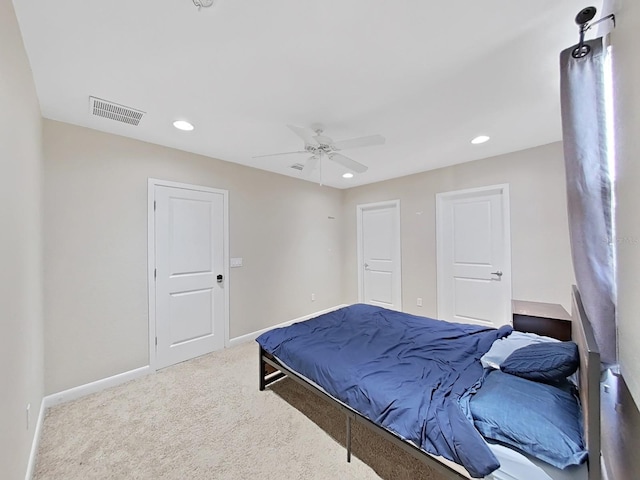 carpeted bedroom featuring ceiling fan