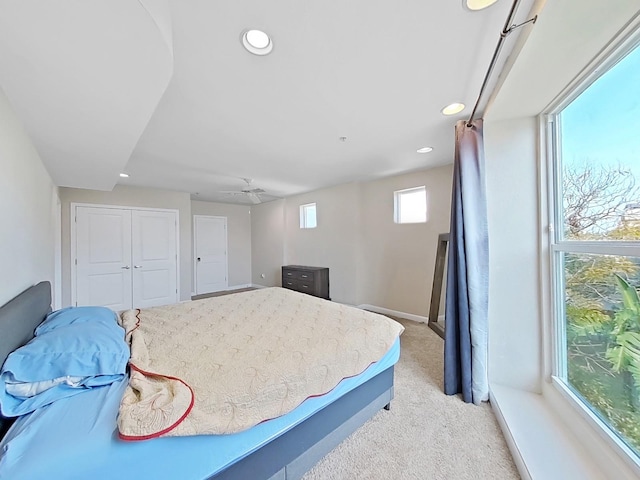 carpeted bedroom with a closet