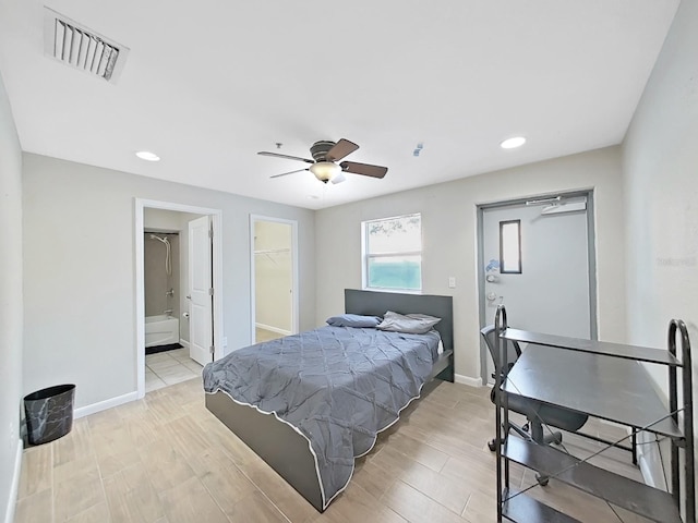 bedroom with ceiling fan and light hardwood / wood-style flooring