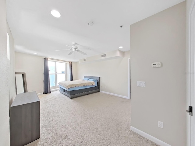 bedroom featuring ceiling fan and carpet