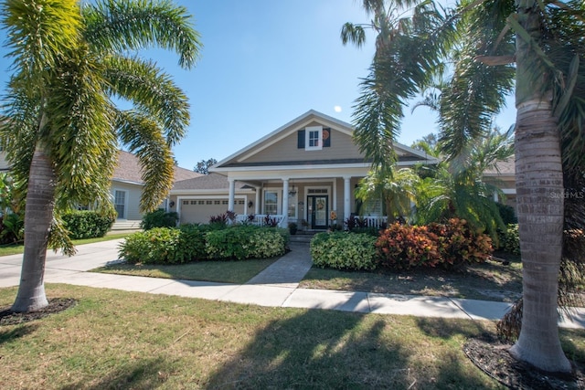 view of front of house featuring a garage and a front lawn