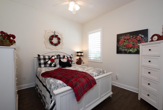 bedroom with ceiling fan and dark hardwood / wood-style flooring