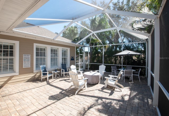 view of patio with a lanai