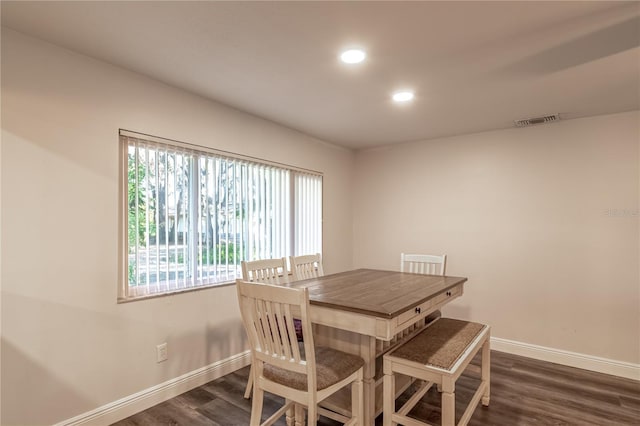 dining room featuring dark hardwood / wood-style flooring