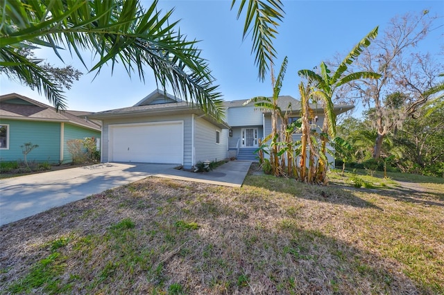 view of front of property featuring a garage and a front yard