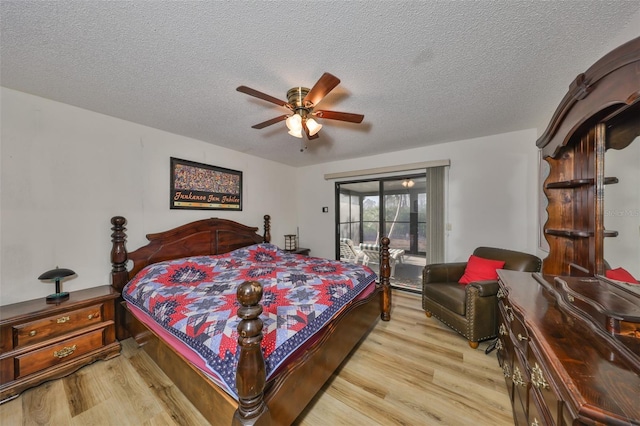 bedroom featuring ceiling fan, access to outside, a textured ceiling, and light wood-type flooring