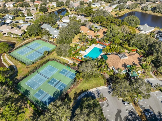 birds eye view of property with a water view